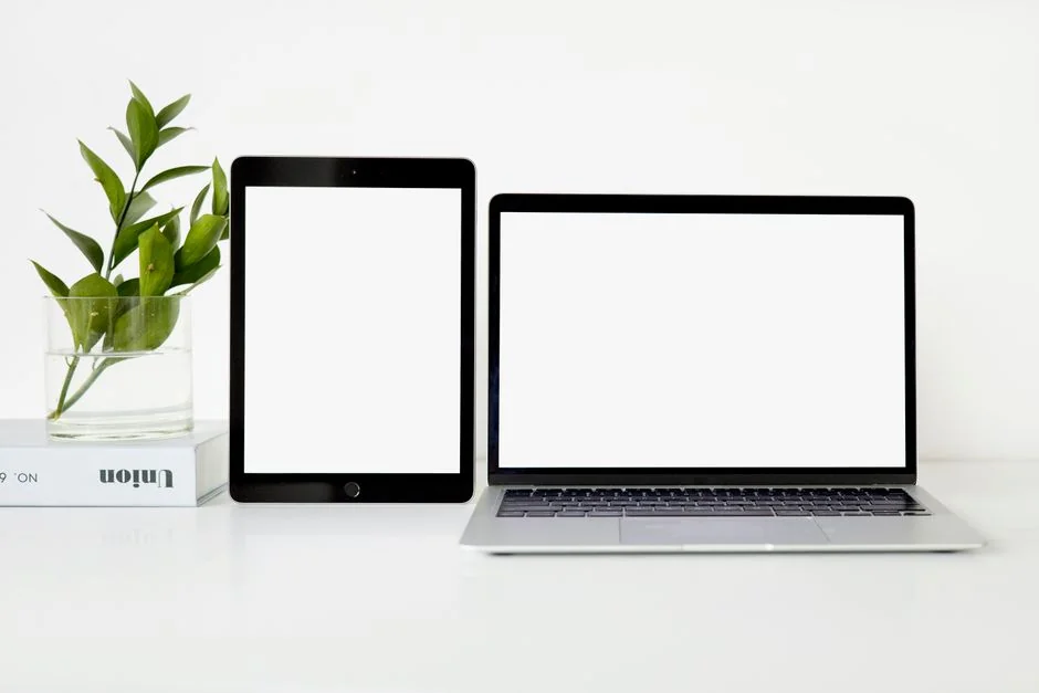 A high-angle view of abstract business cards with cutout details, set against a white background.